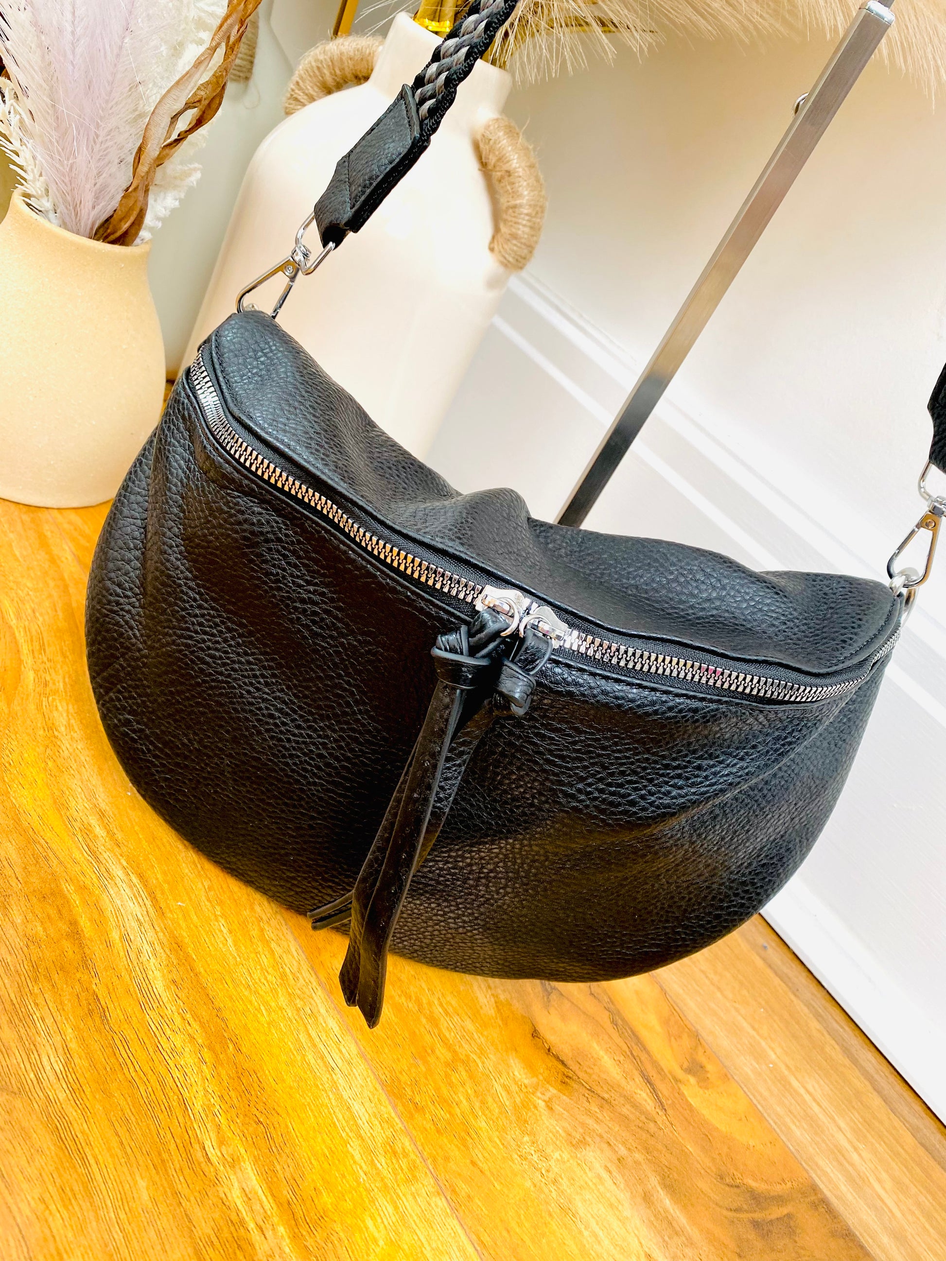 Black faux leather black crossbody bum bag with silver hardware