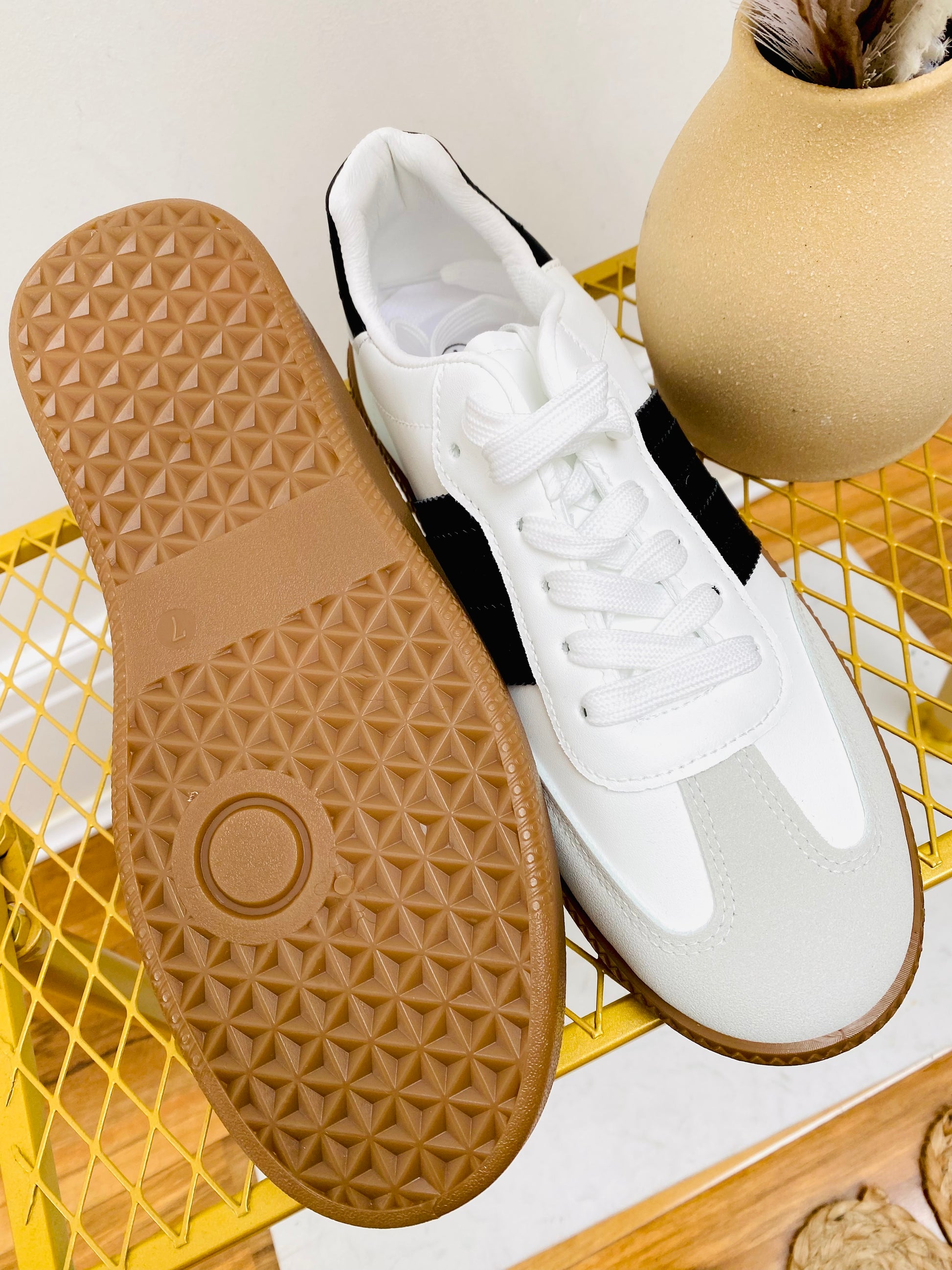 White faux leather sneaker  trainer with black stripe and grey faux suede toe with gum sole.
